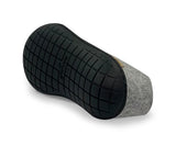 Grey and black foot massager on a white background