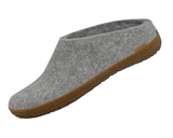 Grey slipper with brown sole on a white background